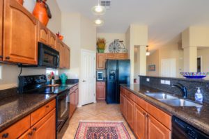 Upgraded Cabinetry, Granite Counter tops, pendant lights, black appliances