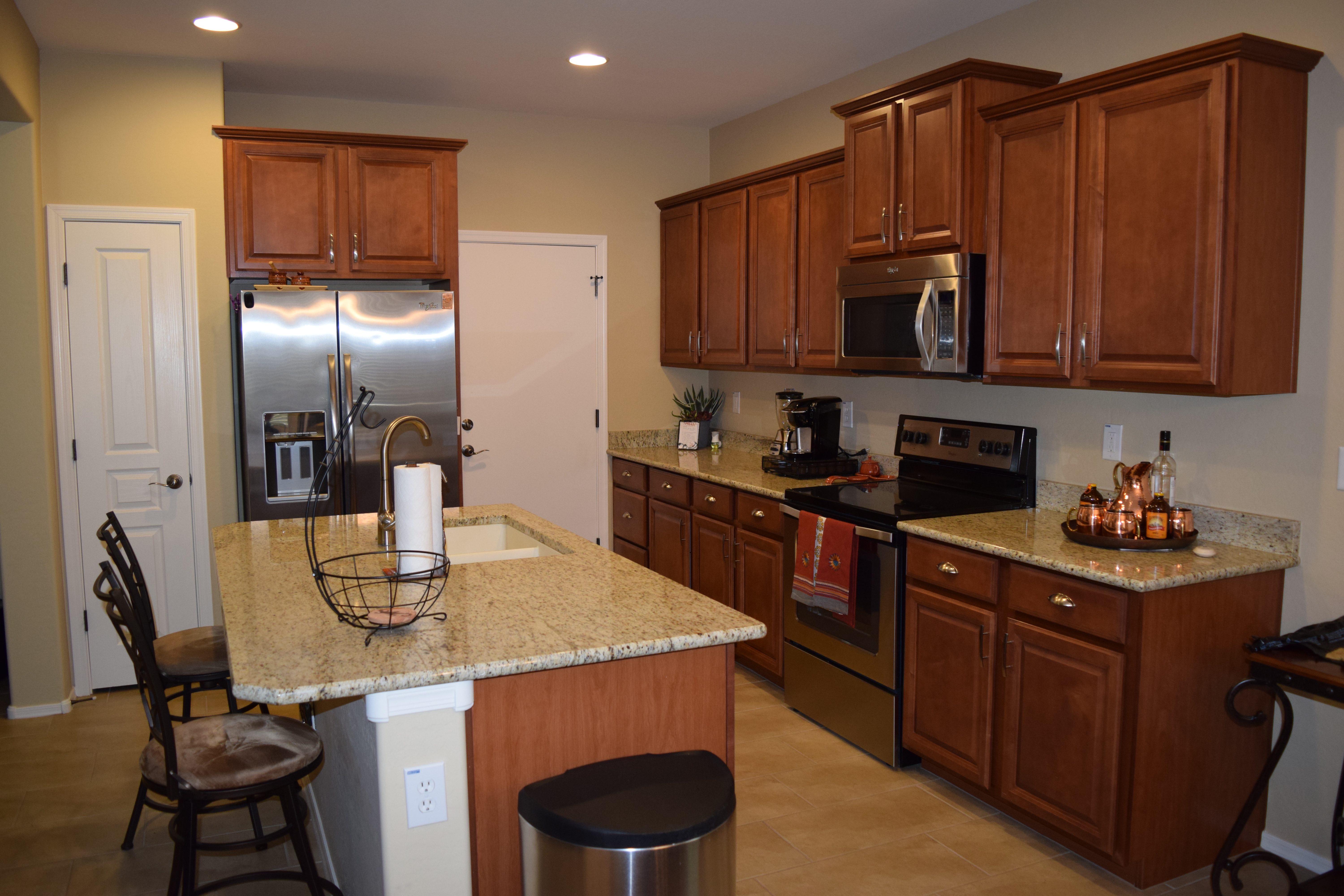 Upgraded Kitchen View, Stainless Steel Appliances, Granite Counter-tops, Kitchen Island, staggered Cabinetry.