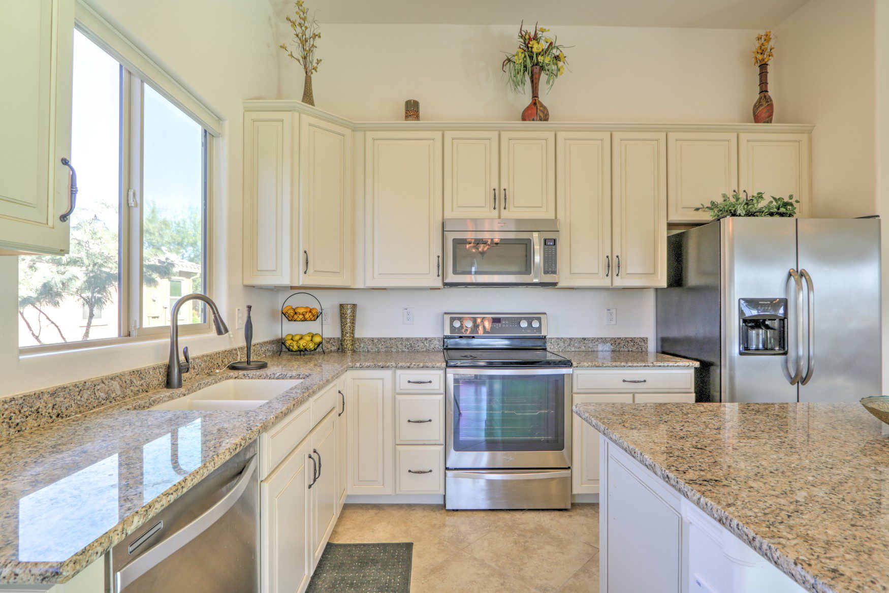 upgraded kitchen, granite counter-tops, white cabinets, stainless steel appliances
